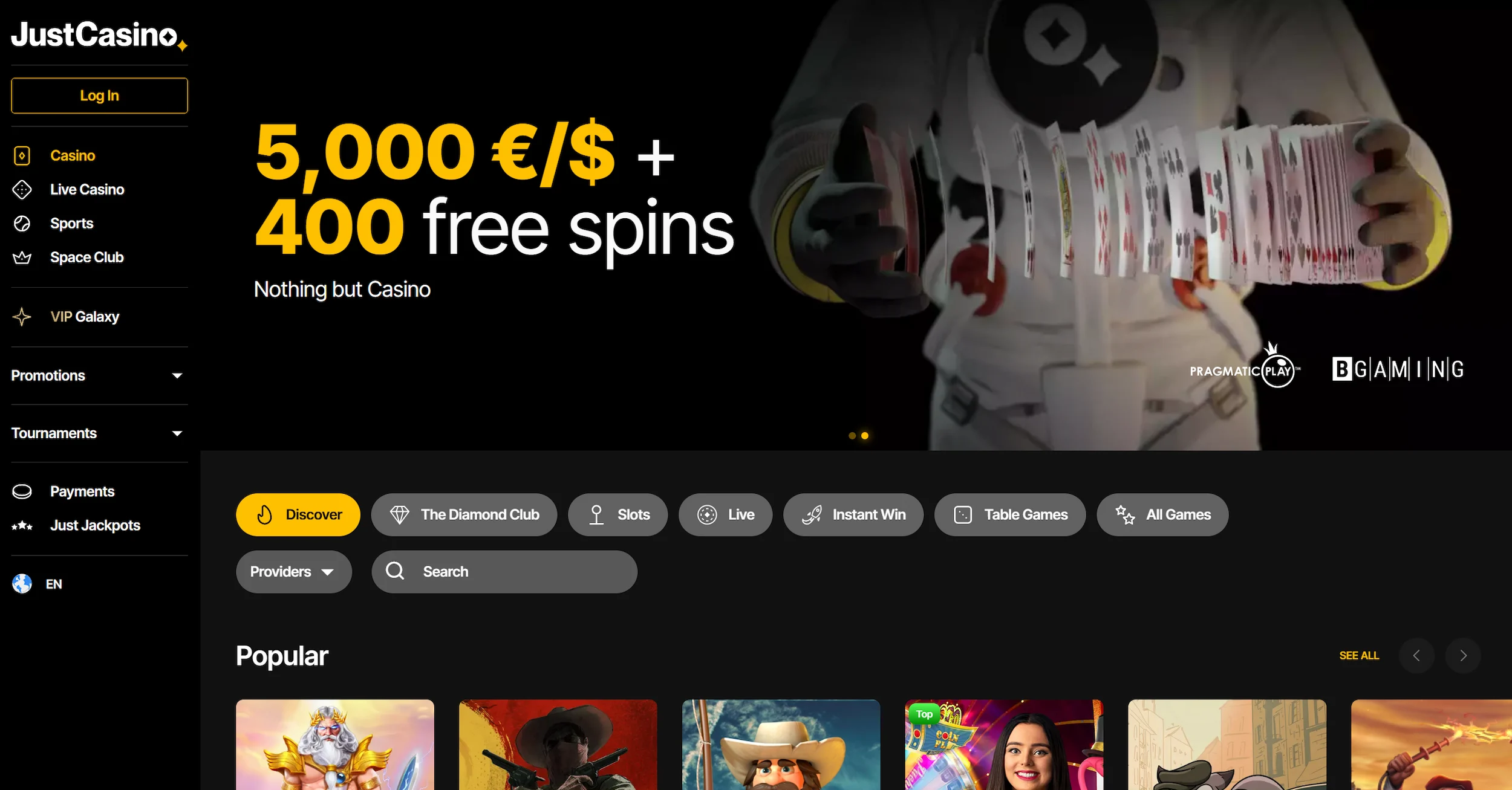 JustCasino frontpage showing welcome bonus offer, popular online pokies and site navigation